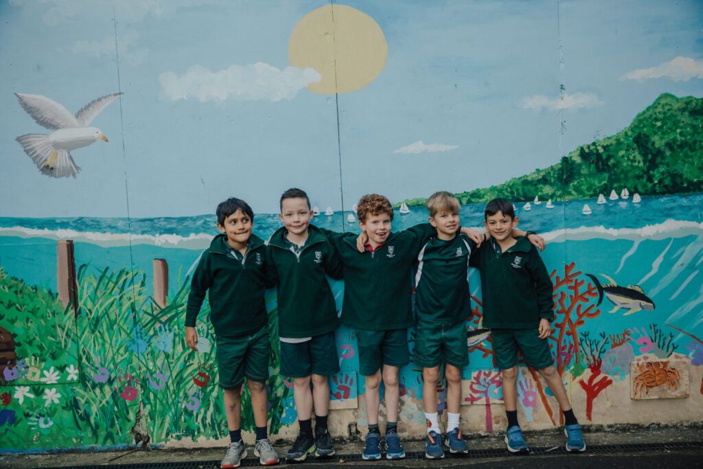 Meadowbank School boys in front of mural